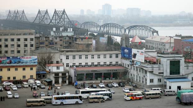 Vehicles wait in March at a border checkpoint to cross into North Korea in Dandong in China's Liaoning province. Chinese authorities are investigating a company that researchers say sold North Korea materials that can be used by its nuclear weapons program. U.S. slaps sanctions on Chinese firm tied to North Korea's nuclear program