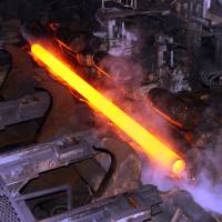 A hot steel pipe is seen at the JFE Steel Corp.’s Chita Works site in Aichi Prefecture. Japan steelmakers suffer as China squeezes coal industry, sending fuel price soaring above $200