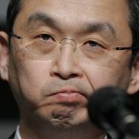 Takata Corp. chief Shigehisa Takada faces reporters in Tokyo in 2015. Takata lines up bids despite uncosted liabilities