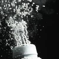 Johnson's baby powder is squeezed from its container. Talc, a mineral mined from soil, has been widely used in cosmetics and other personal care products to absorb moisture since at least 1894, when Johnson's Baby Powder was launched. J&J to fight every suit as long as no link confirms talc causes cancer