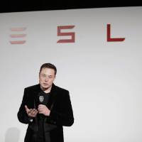 Elon Musk, CEO of Tesla Motors Inc., talks during a news conference at the company's headquarters in Fremont, California, at the end of last September. Musk said Sunday the electric car company is making major improvements to the Autopilot system installed in its vehicles, which will dramatically reduce the number and severity of crashes they're involved in. Tesla's Musk says updated Autopilot would likely have prevented Florida fatality