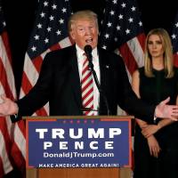 Republican U.S. presidential nominee Donald Trump speaks at a campaign event as his daughter Ivanka looks on in Aston, Pennsylvania, on Tuesday. Trump presidency could cost U.S. economy $1 trillion, research firm says