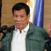 Philippine President Rodrigo Duterte speaks during a news conference in Davao City on Sunday. In latest tirade over killings criticism, Duterte gives middle finger to EU