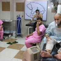 Syrians with breathing difficulties are treated at a make-shift hospital in Aleppo after regime helicopters dropped barrel bombs on the rebel-held Sukkari neighborhood of the northern Syrian city on Tuesday. Mostly civilians hurt in chlorine gas barrel bomb attack on Aleppo laid to Syria regime