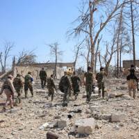Forces loyal to Syrian President Bashar Assad walk at a military complex, after they recaptured areas in southwestern Aleppo that rebels had seized last month, in this handout picture provided by SANA on Monday. 'Events have overtaken' truce talks as Syria regime takes more of Aleppo