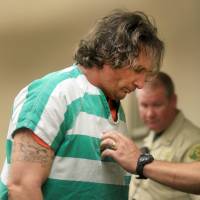 Damin Pashilk is taken from Lake County Calif. Superior Court in Lake County, California, on Aug. 17. Authorities say a GPS tracker revealed Pashilk's vehicle was at the scene of a destructive wildfire about a minute before it started north of San Francisco. GPS placed California arson suspect at scene of several fires, including one that destroyed town