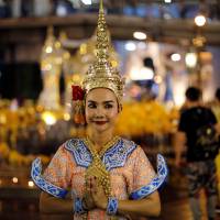 A Thai classical dancer poses for photos at the Erawan Shrine in central Bangkok on Aug. 30. Bangkok edges out London as world's top travel destination