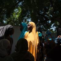 A woman waits at a public health facility in the Dalaram district in Maiduguri, the capital of Borno State, northeastern Nigeria, on Sept. 16. Female victims of Boko Haram forced to sell sex for food in Nigeria camps