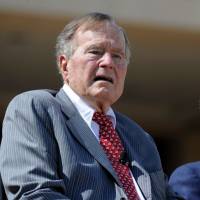 Former U.S. Presidents George Bush and his son, George W. Bush, attend the George W. Bush Presidential Center dedication ceremony in Dallas on April 25, 2013. JFK niece says Bush Senior plans to vote for Clinton in November