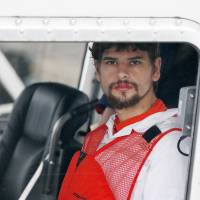 Nathan Carman arrives in a small boat at the U.S. Coast Guard station in Boston Tuesday. Carman spent a week at sea in a life raft before being rescued by a passing freighter. Person of interest in rich granddad’s slaying rescued at sea after boat, mom vanish