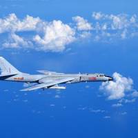 A Chinese Air Force H-6K bomber flies to the western Pacific via the Bashi Strait for a combat simulation drill on Monday. Chinese Air Force announces 'regular' exercises flying through key entryway into western Pacific