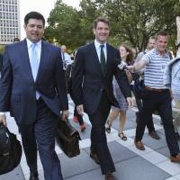 Bill Baroni (center), and his attorney, Michael Baldassare (center left), leave Federal Court after a Sept. 13 hearing for jury selection in Newark, New Jersey. Three years after gridlock paralyzed a New Jersey town next to the George Washington Bridge for four days, two former allies of Christie are going to trial. Christie was told of bridge lane-closure plot at time, witness to testify