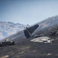 The wreckage of a U-2 spy plane that crashed after taking off from Beale Air Force Base on a training mission in Northern California is seen Tuesda. Authorities say two pilots ejected before the crash Tuesday morning in the Sierra Buttes about 60 miles north of Sacramento. The plane was destroyed and a resulting fire scorched several acres. Air Force pilot dead, another hurt after ejecting before U-2 crashes in California