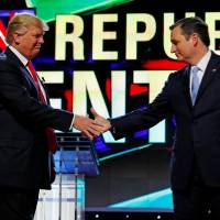 Donald Trump and Ted Cruz shake hands at the start of the Republican presidential candidates' debate at the University of Miami on March 10. Cruz to vote for Trump, whom he once called 'utterly amoral'
