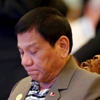 Philippine President Rodrigo Duterte attends a welcome dinner at the ASEAN Summit in Vientiane Tuesday. Duterte issues qualified apology over 'whore' slur after Obama nixes Laos talks