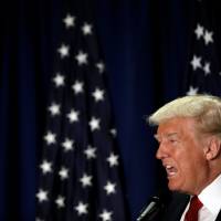 Republican presidential nominee Donald Trump speaks at the Cleveland Arts and Social Sciences Academy in Cleveland Thursday. Fact check finds truth twisted at Trump-Clinton security forum