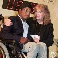 Actress Mia Farrow poses in 2000 with her adopted son, Thaddeus, as they participate in the global summit on polio eradication at United Nations headquarters. Thaddeus Wilk Farrow died Wednesday after being found seriously injured in his vehicle in Connecticut. He was 27. Mia Farrow's paraplegic son Thaddeus, 27, died of self-inflicted gunshot wound: medical examiner