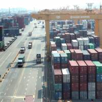 Containers lie stacked up at a cargo terminal of Hanjin Shipping in the South Korean port city of Busan on Thursday. Drowning Hanjin may not be alone among global shippers