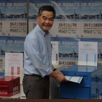 Hong Kong Chief Executive Leung Chun-ying votes at a polling station for the Legislative Council election on Sunday. Hong Kong votes in test of China's influence over regional financial hub