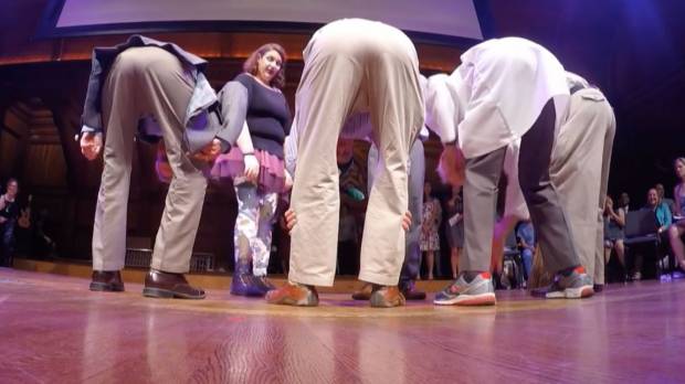 Scientists demonstrate a different perspective by peering between their legs at the 2016 Ig Nobel award ceremony Thursday at Harvard University. Professors Atsuki Higashiyama and Kohei Adachi won the perception prize for their research, presented in the paper Perceived size and perceived distance of targets viewed from between the legs: Evidence for proprioceptive theory. Japanese scientists bend over forward to win an Ig Nobel prize for perception study
