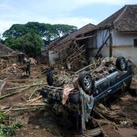Rescue teams search for missing victims near the Cimanuk River in the Garut district of West Java province in Indonesia on Thursday, a day after a series of landslides and flash floods hit several areas. 26 dead, 19 missing in Indonesian landslides, floods