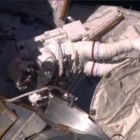 Expedition 48 Commander Jeff Williams prepares to re-enter the International Space Station after a nearly seven-hour space walk to pack up a spare cooling radiator and install a high-definition television camera outside the orbiting laboratory in this still image from NASA video taken Thursday. ISS pair take second spacewalk in two weeks to retract radiator