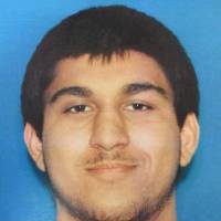 This undated image courtesy of Washington state police shows the driver's-license picture of Cascade Mall shooting suspect Arcan Cetin, 20, a resident of Oak Harbor, Washington. Police say Washington shooting suspect was 'zombie-like' at time of arrest