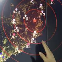 An official in Seoul of the Earthquake and Volcano of the Korea Monitoring Division points at the epicenter of seismic waves from North Korea's nuclear test on Friday. North Korea's fifth atomic test advances goal of nuclear missiles