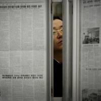 A North Korean man reads the local newspapers displayed in a subway station as seen during a press tour in Pyongyang in May. With a tightly controlled state media, little access to outside news and a deep belief that whoever runs the White House is bound to be their sworn enemy, North Koreans aren't expecting much from the U.S. elections — if they know about them at all. Donald who? Most North Koreans don't know — or care — about U.S. election