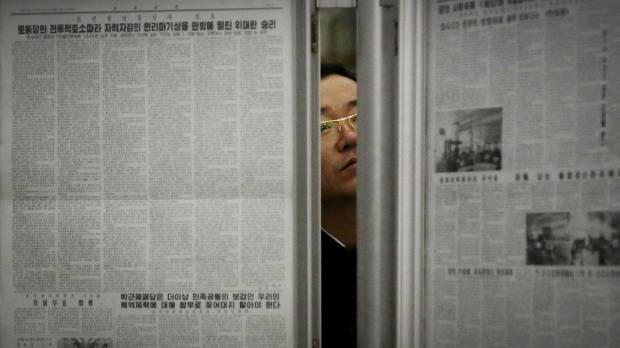 A North Korean man reads the local newspapers displayed in a subway station as seen during a press tour in Pyongyang in May. With a tightly controlled state media, little access to outside news and a deep belief that whoever runs the White House is bound to be their sworn enemy, North Koreans aren't expecting much from the U.S. elections — if they know about them at all. Donald who? Most North Koreans don't know — or care — about U.S. election