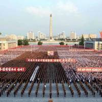 This undated photo, released by North Korea's Korean Central News Agency on Sept. 13, shows people at a rally held in Pyongyang's Kim Il Sung Square celebrating the success of the country's recent nuclear test. Some of North Korea's old friends take steps to isolate regime of Kim Jong Un
