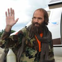 Freed Norwegian national Kjartan Sekkingstad waves as he prepares to board a plane at Jolo airport, on the southern Philippine island of Mindanao, on Saturday. Freed Norwegian hostage says Philippine kidnapping was 'devastating'
