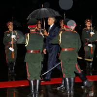 U.S. President Barack Obama is greeted with an honor guard and red carpet as he arrives aboard Air Force One, ahead of the ASEAN Summit, at Wattay International Airport in Vientiane Monday. Obama meets Laotian leader in first U.S. presidential visit
