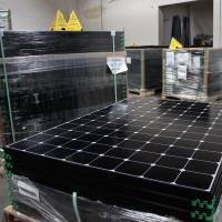 The latest generation of SunPower solar panels are stacked in March in Positive Energy Solar's warehouse in Albuquerque, New Mexico. Mostly unnoticed amid the political brawl over climate change, America has undergone a quiet transformation in how and where it gets its energy during Barack Obama's presidency, slicing the nation's output of polluting gases that are warming Earth. Obama fostered big changes in energy, cuts in pollution but did so quietly
