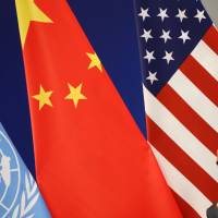 U.S. President Barack Obama listens during a joint ratification of the Paris climate change agreement with Chinese President Xi Jinping and U.N. Secretary-General Ban Ki-moon on Saturday in Hangzhou, China. Highlights of the Paris climate pact ratified by the U.S. and China