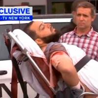 A still image captured from a video from WABC television shows a conscious man believed to be New York bombing suspect Ahmad Khan Rahami being loaded into an ambulance after a shootout with police in Linden, New Jersey, Monday. NYC bomb suspect got violent after Pakistan stay, was scrutinized by FBI in 2014, had al-Qaida writings