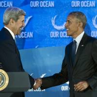 Secretary of State John Kerry welcomes President Barack Obama prior to the president speaking at the Our Ocean, One Future conference at the State Department in Washington Thursday. Obama declares new Atlantic marine reserve at ocean summit; other states set to follow his lead