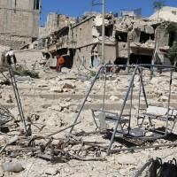Damage to the rebel-held Aleppo neighborhood of Tariq al-Bab is seen Saturday following airstrikes carried out by government forces. U.S., European allies say Russia must take 'extraordinary steps' to save Syria truce