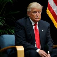 U.S. Republican presidential nominee Donald Trump holds a Hispanic Town Hall meeting with supporters in Miami Tuesday. As Clinton cheers, Donald Trump digs in after debate