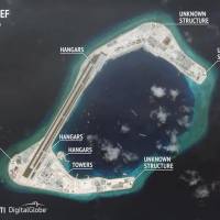 Construction os seen on Subi Reef in the Spratly Islands of the disputed South China Sea in this July 24 satellite image. In interview, Obama to urge China to stop flexing muscles over South China Sea
