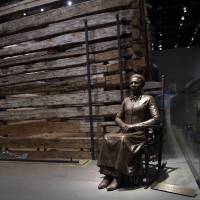 A statue of pioneer Clara Brown, who was born a slave in Virginia around 1800, is displayed at the National Museum of African American History and Culture in Washington on Wednesday. After she was freed when her owner died in 1856, Brown traveled to Colorado, where she established a successful laundry business. Smithsonian museum chronicling black history opens