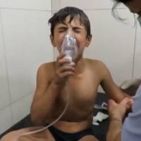 A Syrian boy breathes with an oxygen mask at a hospital in this image from a video taken Sept. 7, a day after a suspected chlorine gas attack in Aleppo. U.N. inquiry blames Syrian military for chlorine bomb attacks, diplomat says