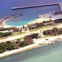 This undated handout picture released Thursday shows four Y-shaped structures (foreground center) jutting out to sea on the Taiwan-controlled Taiping Island that is part of the Spratlys archipelago in the South China Sea. Taiwan's Defense Ministry has asked Google to blur images of a new development believed to be for military use on a disputed island. Taiwan asks Google to blur images of apparent military developments on Taipei-held South China Sea island