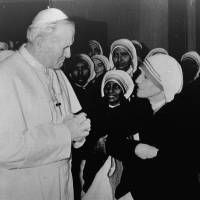 Pope John Paul II talks with Mother Teresa after he celebrated a Mass for her in his private chapel at the Vatican on Dec. 13, 1980. Pope Francis declares Mother Teresa a saint during Vatican ceremony