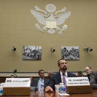 Paul Combetta and Bill Thornton, both of Platte River Networks, arrive on Capitol Hill in Washington, Tuesday to testify before the House Oversight and Government Reform Committee hearing on Examining Preservation of State Department Records. The empty seat of Bryan Pagliano, former senior adviser, Information Resource Management, State Department, who did not appear is at left. Trio linked to Clinton email server refuse to testify in Republican-led House hearing
