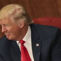 Republican presidential candidate Donald Trump speaks at luncheon for the Economic Club of New York in New York Thursday. Trump in excellent health, takes cholesterol drug, is overweight, note from doctor says