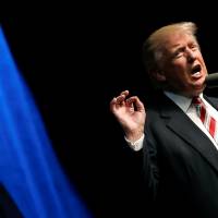 Republican presidential nominee Donald Trump speaks at a campaign rally in Clive, Iowa, Tuesday. Trump-touted child care measures seen as tax deductions, havens for the rich