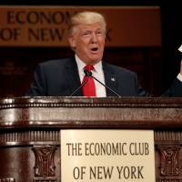 Republican presidential nominee Donald Trump speaks to the Economic Club of New York luncheon in Manhattan, New York, Thursday. Trump tax-axing, job-boosting vision doesn't seem to add up; food safety rollbacks quickly deleted