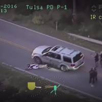 This image from video provided Tuesday by the Tulsa Police Department in Tulsa, Oklahoma, shows the officer involved shooting of Terence Crutcher. Tulsa policewoman charged with first-degree manslaughter over unarmed black motorist's death