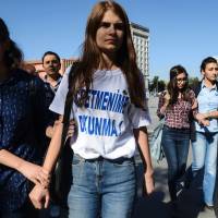 Turkish police detain a student wearing a T-shirt reading Don't touch my teacher! in Diyarbakir on Monday during a protest over the suspension of teachers for suspected links to militants. Turkey sacks 28,000 teachers allegedly linked to coup, Kurdish militants